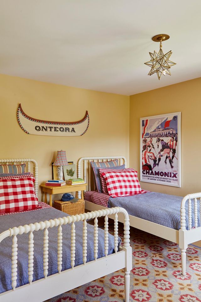 yellow bedroom with red and blue americana decor