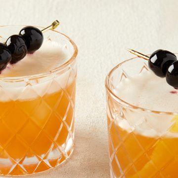 two amaretto sours garnished with cherries