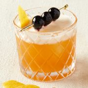 two amaretto sours garnished with cherries