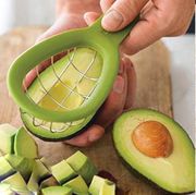 avocado slicer and hand with rings