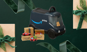 the radio flyer amazon delivery van ride on on a background of festive presents