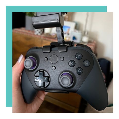 hand holding luna gaming controller