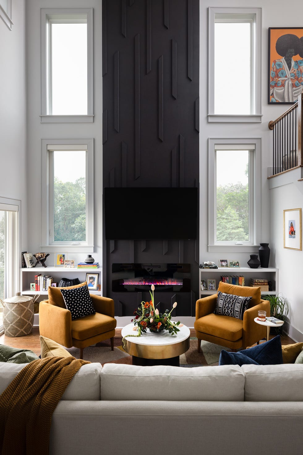 living room with black fireplace wall