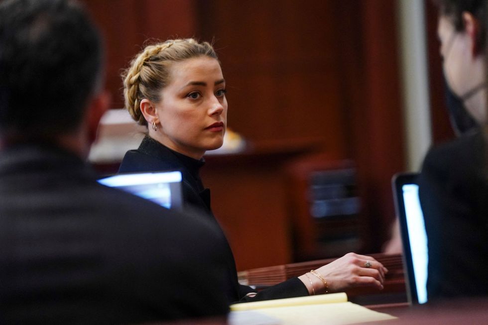 us actress amber heard looks over he shoulder during the 50 million us dollars depp vs heard defamation trial at the fairfax county circuit court in fairfax, virginia,on april 14, 2022   heard is being sued for defamation by her former husband, us actor johnny depp, after she wrote an op ed in the washington post in 2018 that, without naming depp, accused him of domestic abuse photo by shawn thew  pool  afp photo by shawn thewpoolafp via getty images