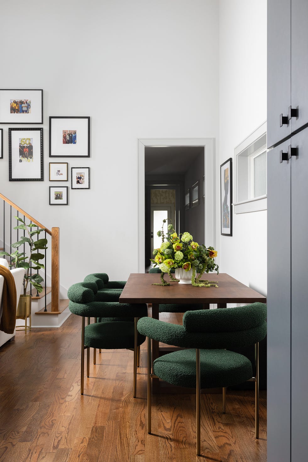 dining room with green chairs