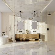 a massive bathroom with marble floors and walls