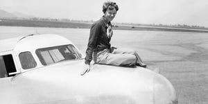 Aviatrix Amelia Earhart Posing on Airplane