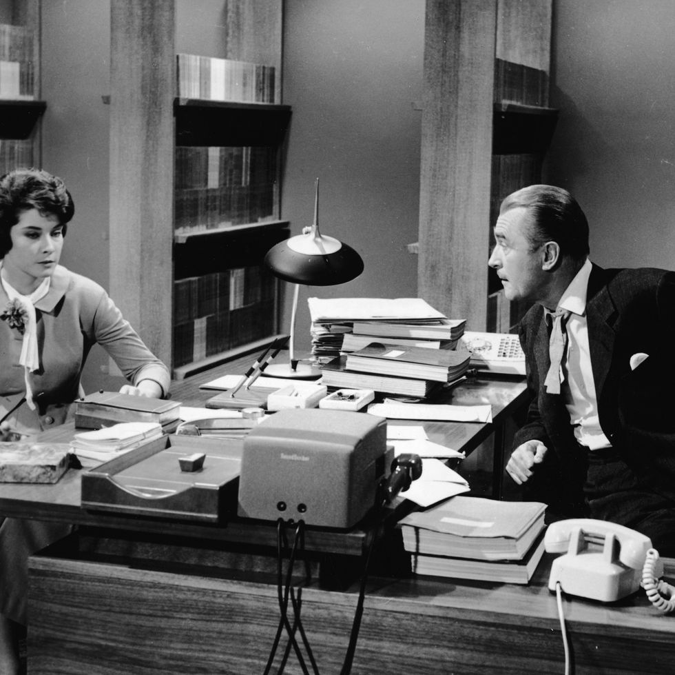 american actor diane baker and british actor brian aherne (1902 1986) sits across a desk from each other in a scene from 'the best of everything,' directed by jean negulesco, 1959. (photo by 20th century fox/courtesy of getty images)
