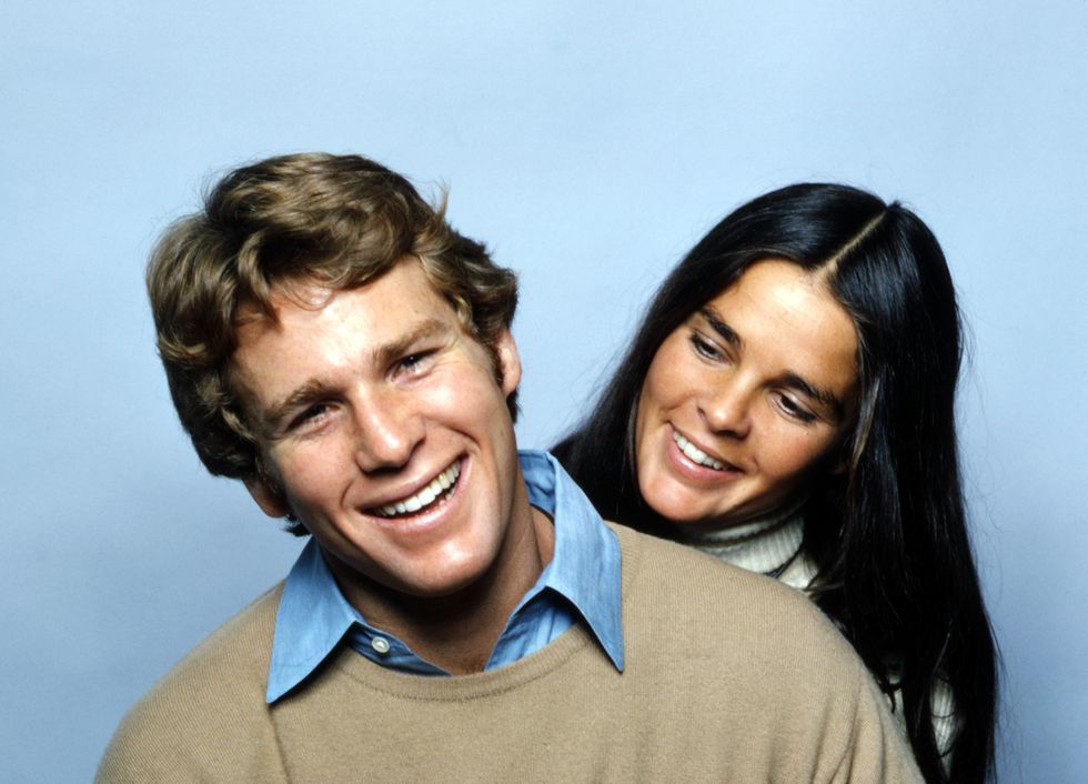 ryan o neal and ali macgraw smiling in a promo photo for love story