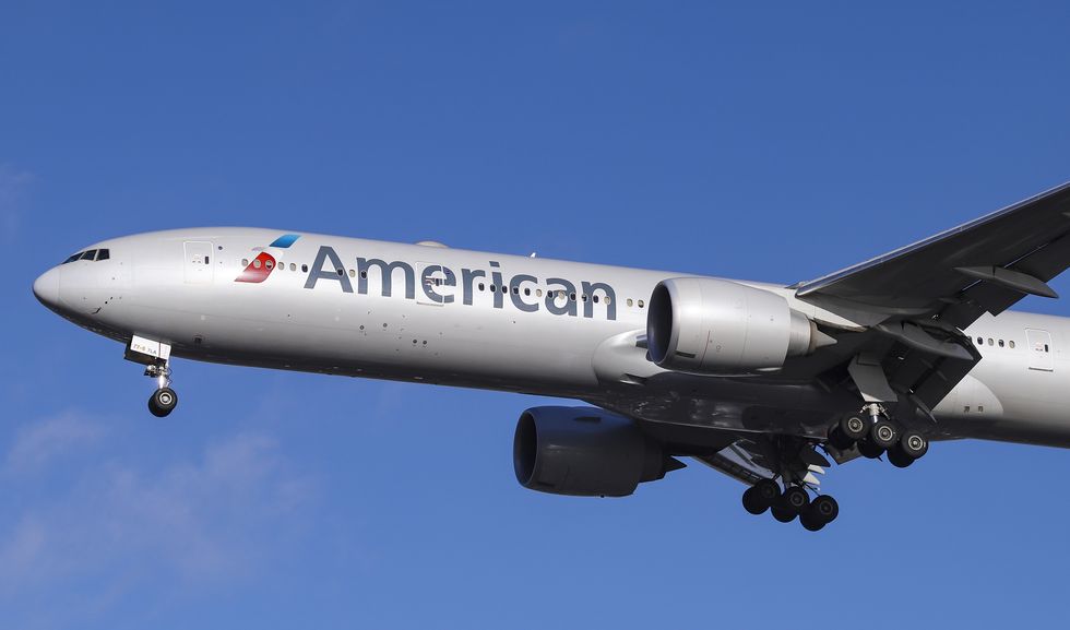 American Airlines Boeing 777-300 with registration N717AN is...
