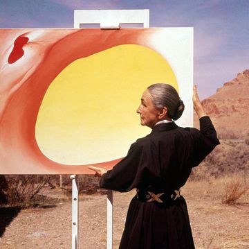 georgia o'keeffe with painting in desert, nm