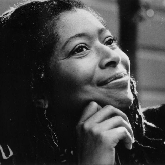 alice walker smiles and looks up as she rests her head on her hand