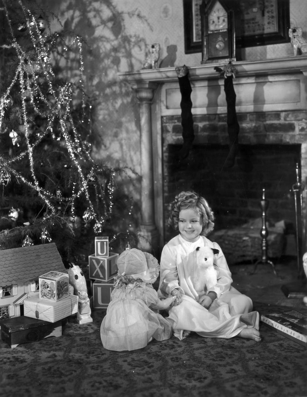 shirley temple sitting by christmas tree