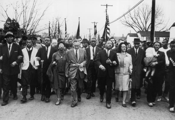 american civil rights campaigner martin luther king 1929  1968 and his wife coretta scott king lead a black voting rights march from selma, alabama, to the state capital in montgomery among those pictured are, front row, politician and civil rights activist john lewis 1940 – 2020, reverend ralph abernathy 1926  1990, ruth harris bunche 1906  1988, nobel prizewinning political scientist and diplomat ralph bunche 1904  1971, activist hosea williams 1926 – 2000