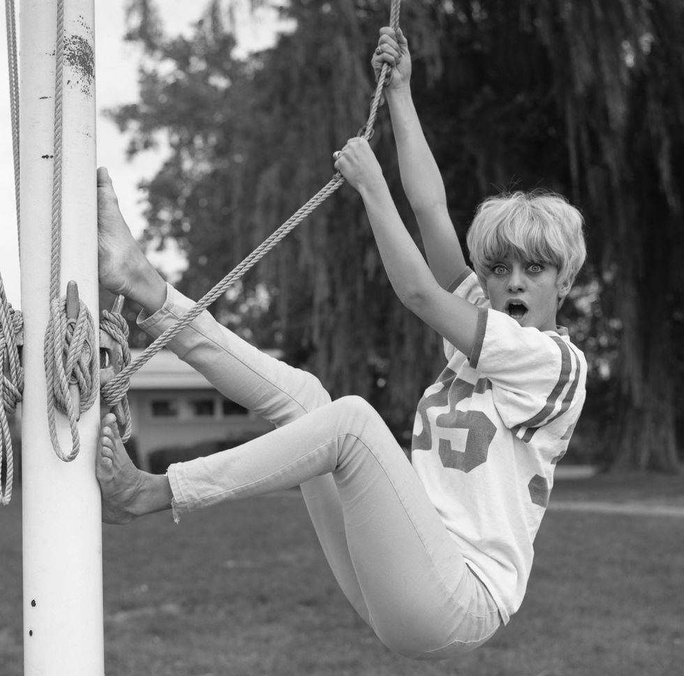 Goldie Hawn Hangs From A Flag Pole
