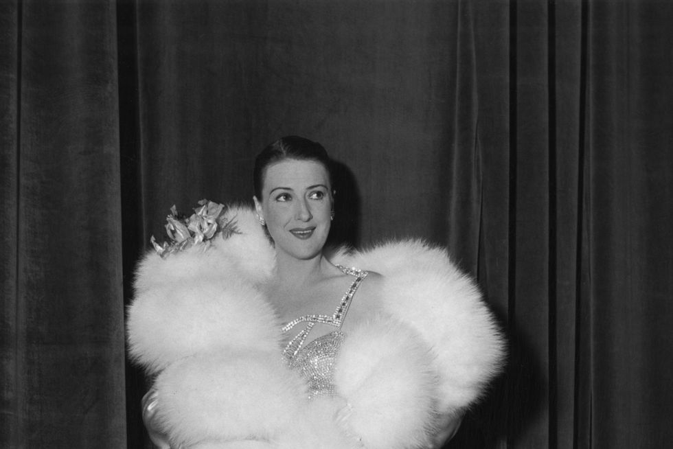 gypsy rose lee poses in fur stole