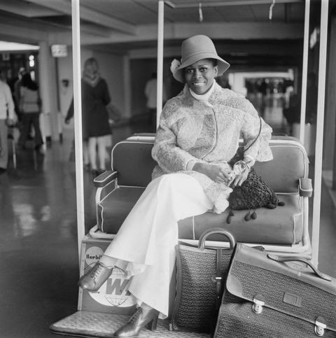 cicely tyson with suitcases at heathrow airport