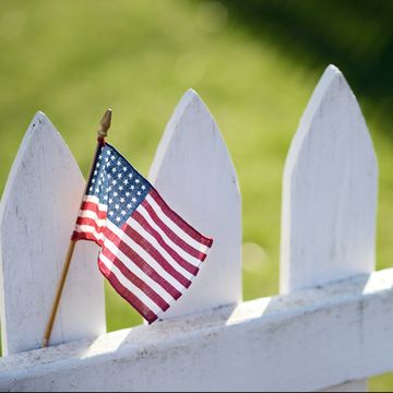 American Flag on White Picket Fence