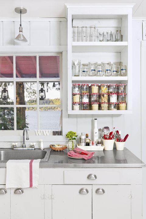 white cottage kitchen with red accents