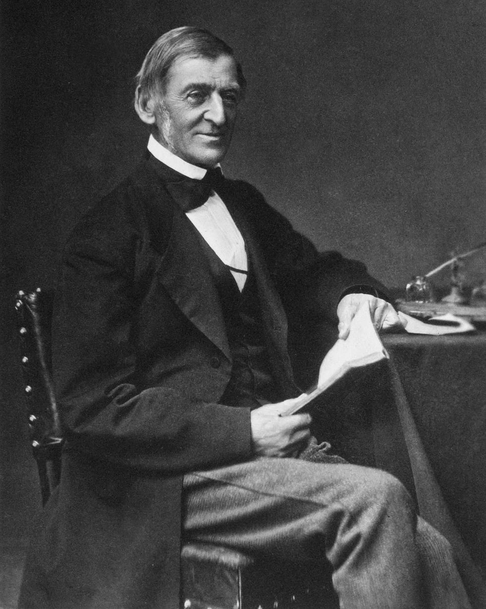 Ralph Waldo Emerson is one of the most famous and influential poets ralph waldo emerson sitting at a table and holding a book as he looks up