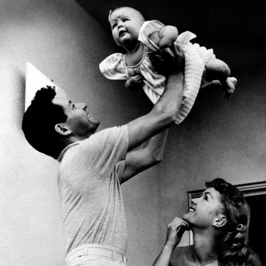 eddie fisher holding carrie fisher in his arms beside debbie reynolds