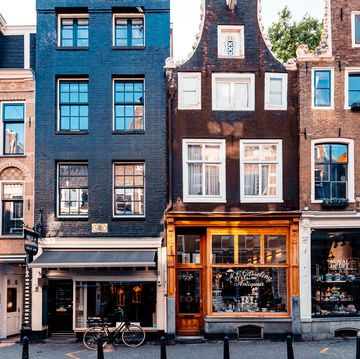 amsterdam street with small shops and cafes, holland, netherlands