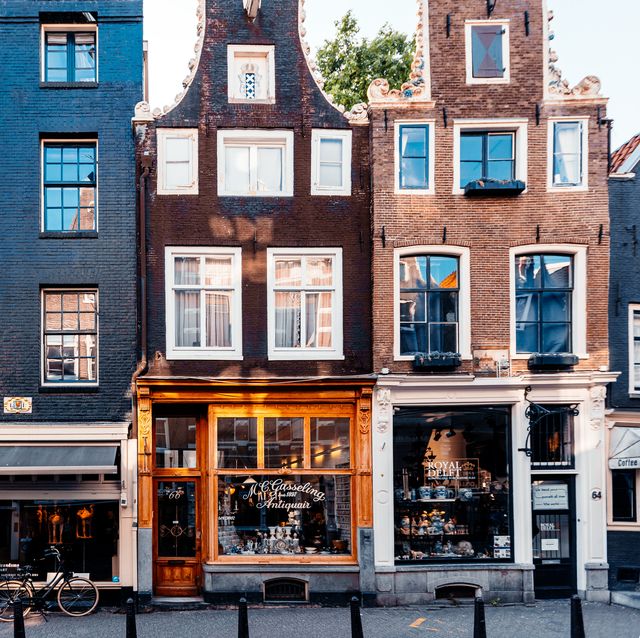 amsterdam street with small shops and cafes, holland, netherlands