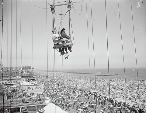"original caption a couple on the parachute ride at coney island, new york"