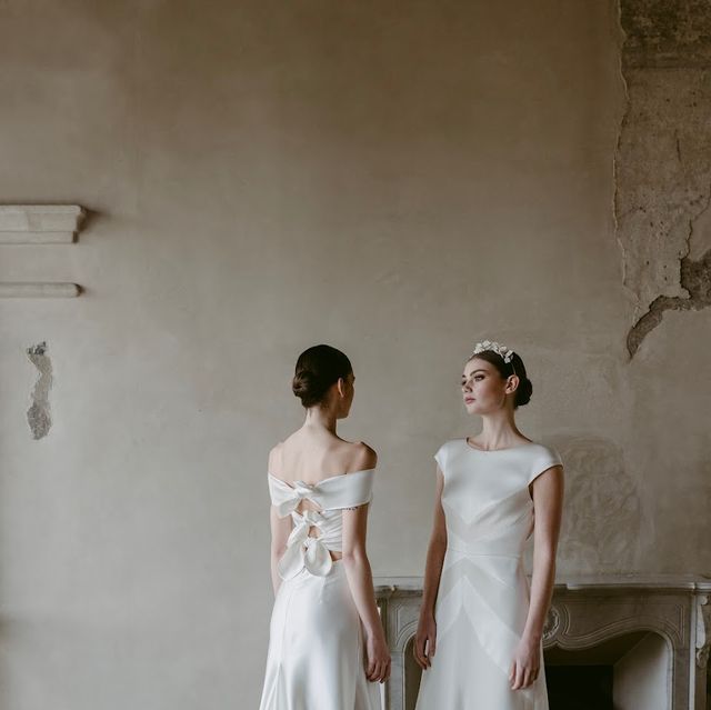 two women in wedding dresses