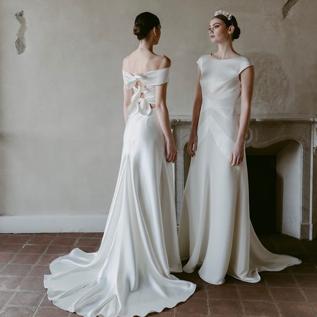 two women in wedding dresses