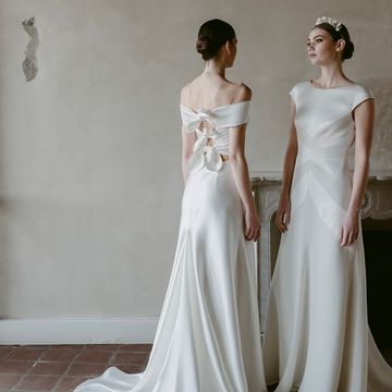 two women in wedding dresses