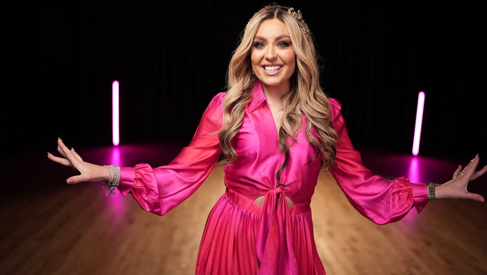 amy dowden wearinf a pink satin dress on dare to dance