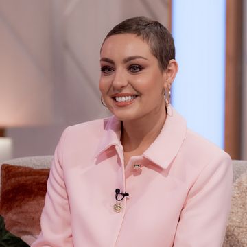 amy dowden wearing a big smile and a pale pink shirt on lorraine