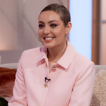 amy dowden wearing a big smile and a pale pink shirt on lorraine