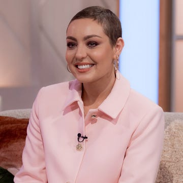 amy dowden wearing a big smile and a pale pink shirt on lorraine