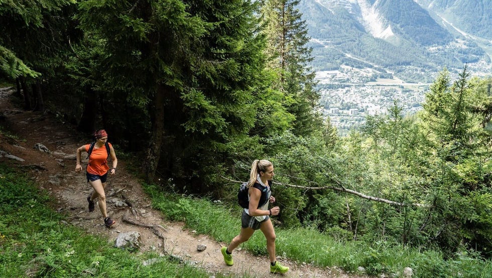 Amy Schlinger running on a trail testing running vests amy schlinger running on a trail testing running vests
