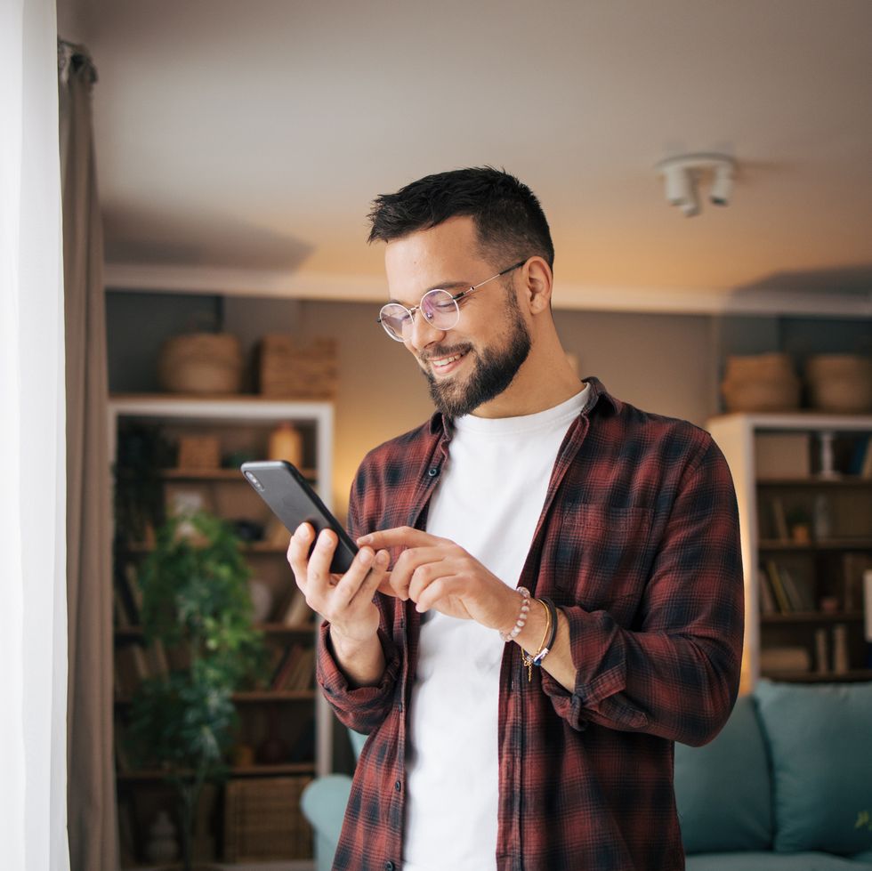 man is using his smartphone