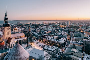 an aerial view of the tallinn skyline at sunrise