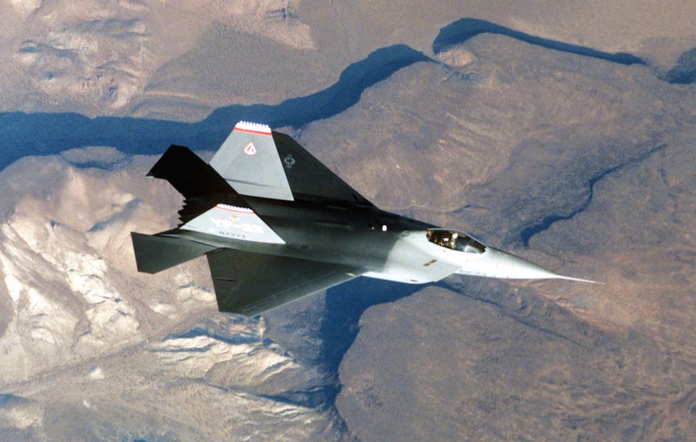 an air to air overhead view of the yf 22 advanced tactical fighter aircraft