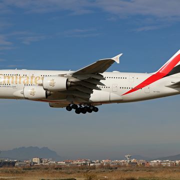 diverse emirates airbus a380 landing in barcelona