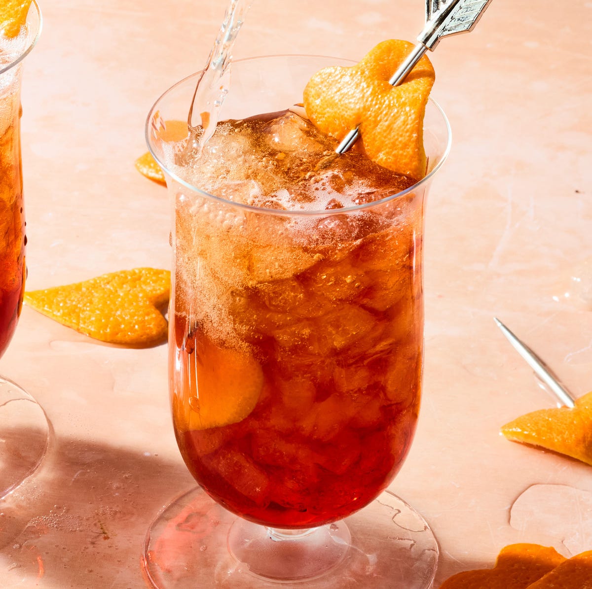 An Americano In Paris americano in a tall glass with orange peel heart garnish