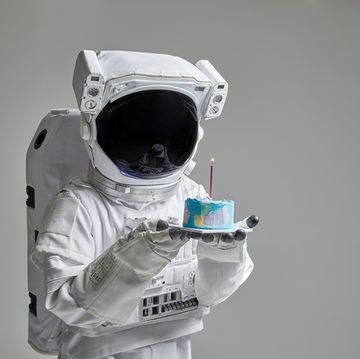 an astronaut with a cake