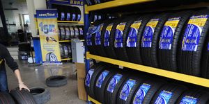 an employee works at a tyre store in hefei, anhui province
