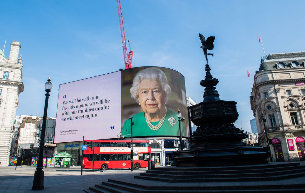 quotes from queen's coronavirus broadcast displayed in piccadilly circus