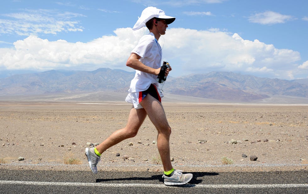 an unidentified runner makes his way acr