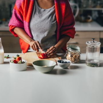 an unrecognizable woman preparing healthy breakfast in the kitchen