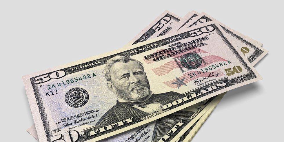 a pile of 50 dollar banknotes each featuring a portrait of ulysses s grant facing forward