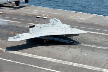 an x 47b unmanned combat air system makes an arrested landing