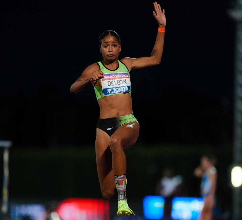 athlete performing a jump in a track and field event