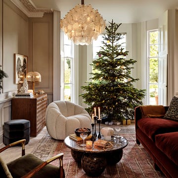 a living room with a christmas tree